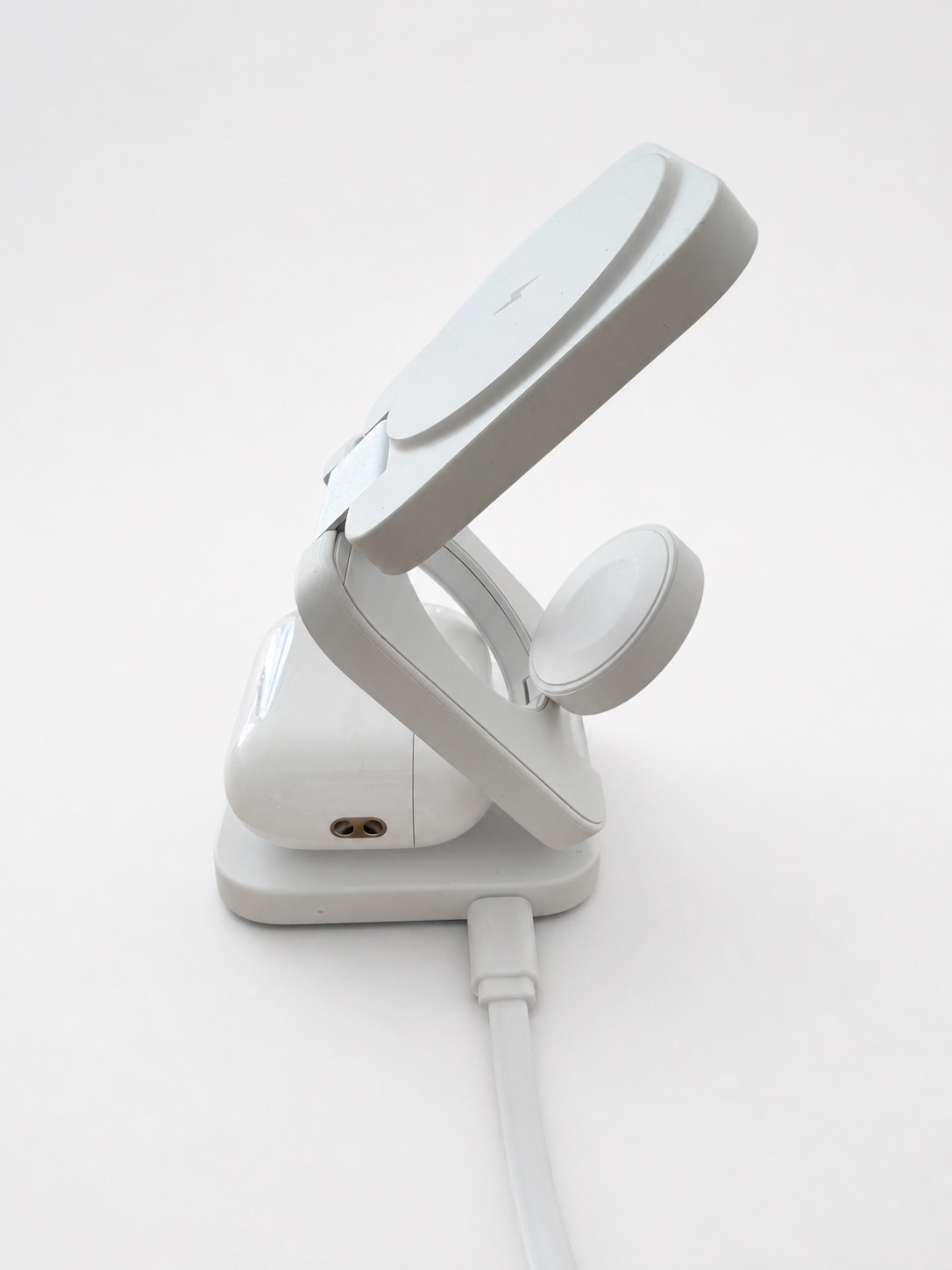 TRIPL charger in charging mode with a tiny warm red status light on the front edge
